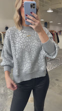 Load and play video in Gallery viewer, Wildly Cozy Foil Animal Print Sweater
